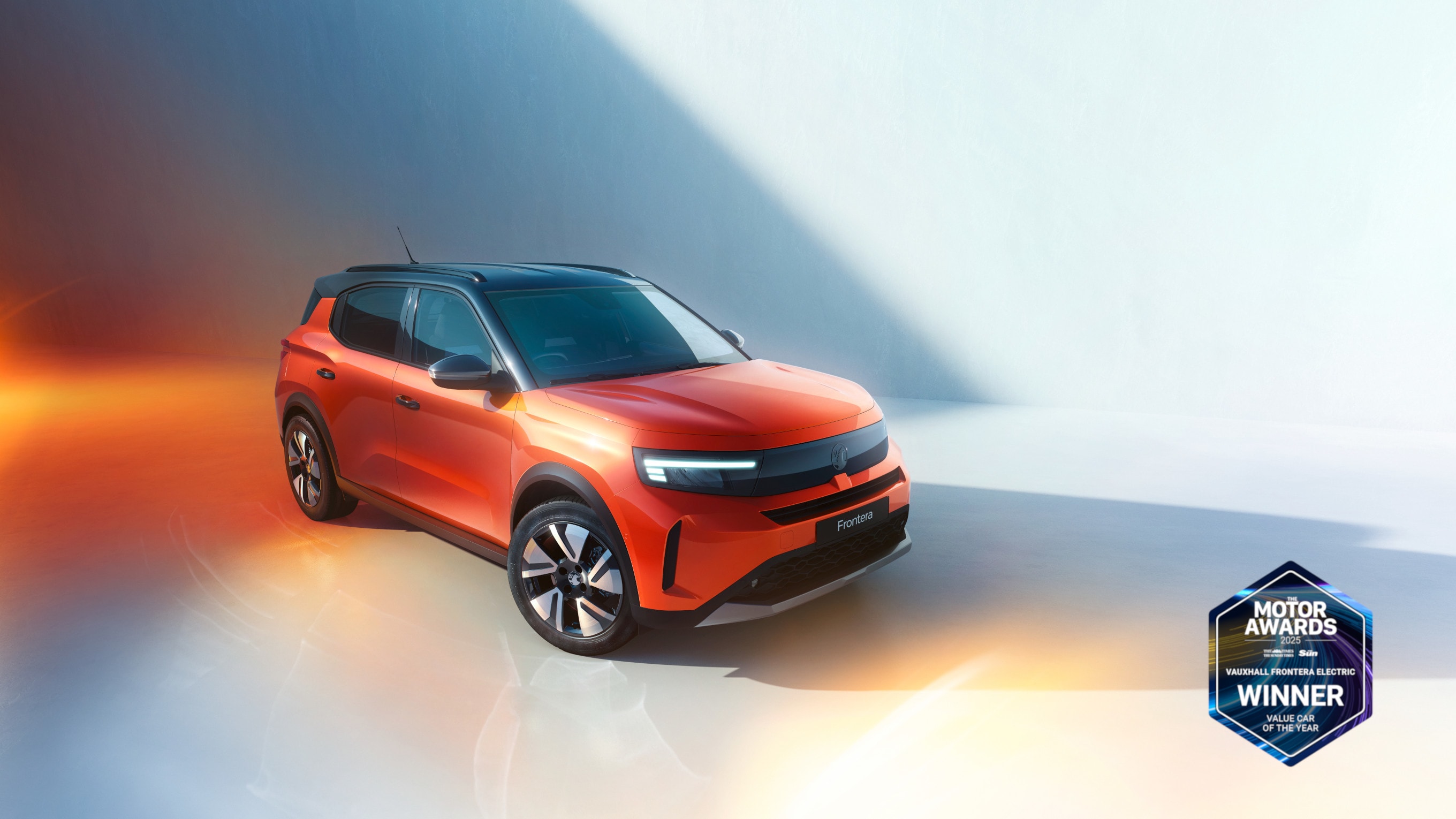Right side and Front view of an orange Vauxhall Frontera Family SUV