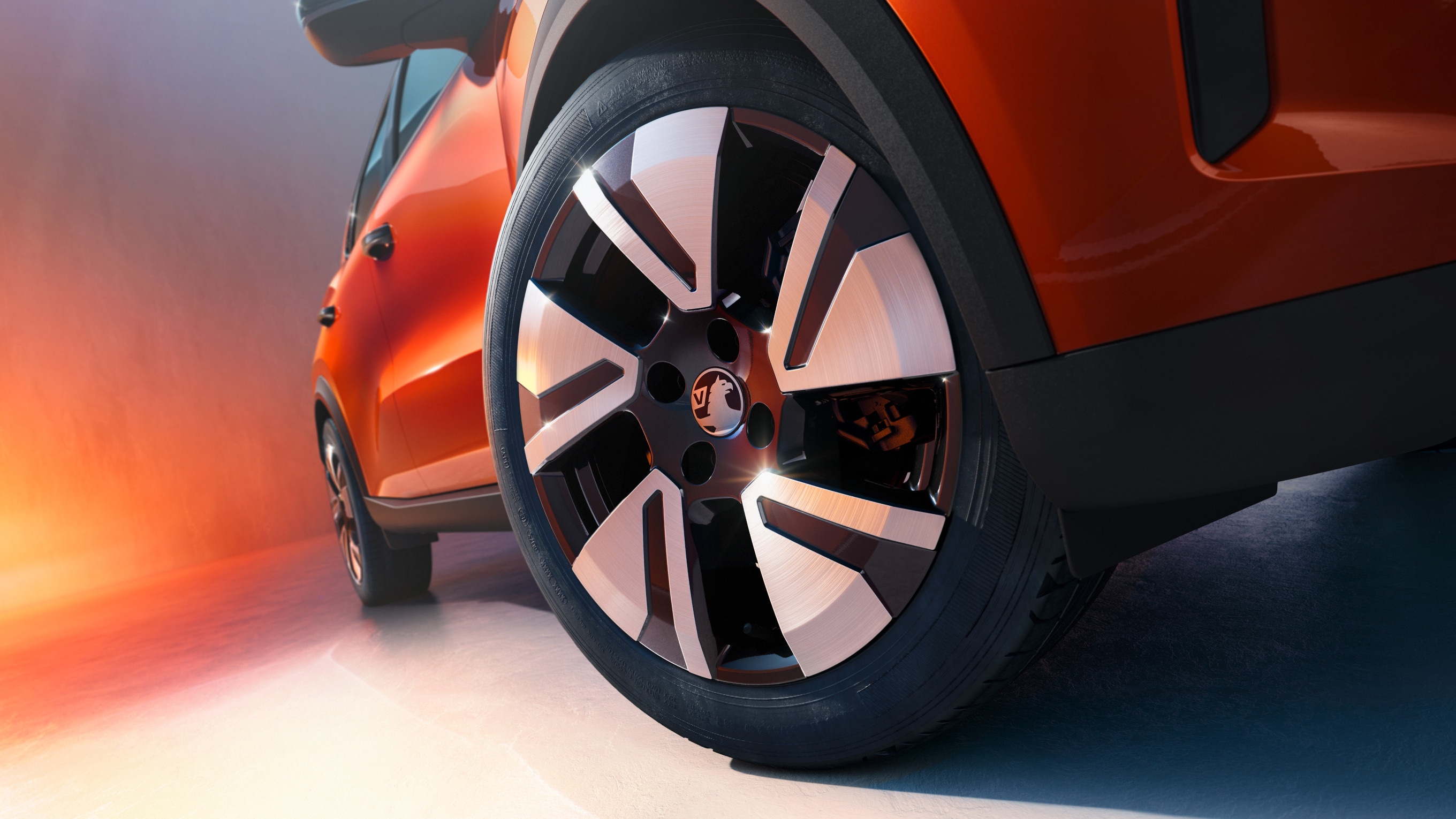 Top view of the Front and Left side of an orange Vauxhall Frontera with black roof