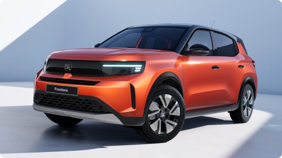 Front and Left side view of an orange Vauxhall Frontera GS